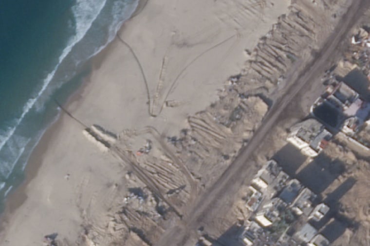 Satellite imagery of a beach near Gaza City on Nov. 30 showing pipes laid on the sand.