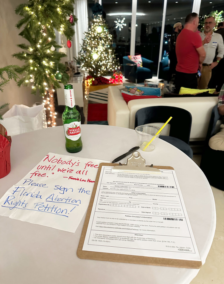 Petition on a table at holiday party.