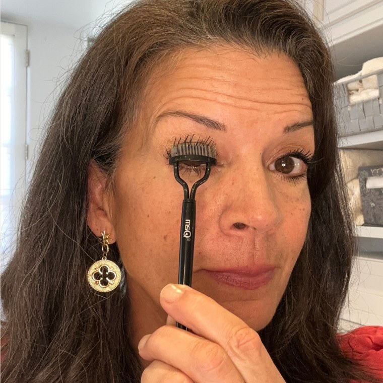 Dina Eastwood uses the MSQ Eyelash Comb to get rid of clumps in her mascara.
