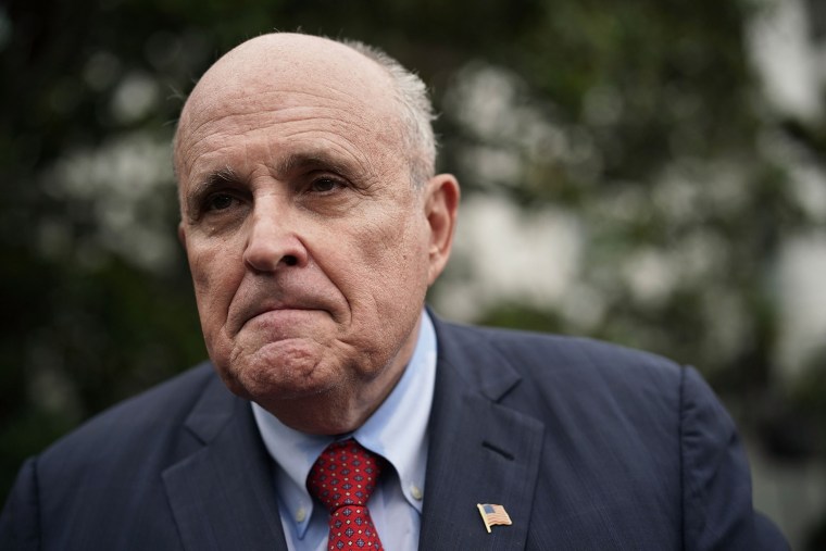 Rudy Giuliani speaks to members of the media during a White House Sports and Fitness Day at the South Lawn of the White House.