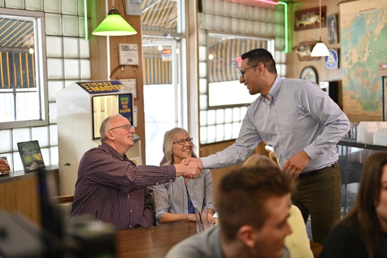 Tony Vargas greets customers at a diner in Omaha in 2022. 