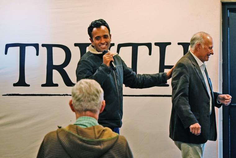 Republican presidential candidate Vivek Ramaswamy with former Rep. Steve King at an event in Iowa on Dec. 13, 2023.