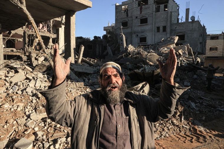 A Palestinian man reacts amid the rubble of buildings destroyed following Israeli bombardment on Rafah, in the southern Gaza Strip, on December 15, 2023.