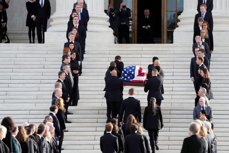 Supreme Court Justice Sandra Day O'Connor's flag-draped casket is carried up the steps of the Supreme Court 