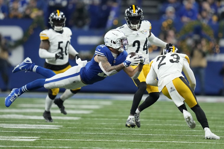 Indianapolis Colts wide receiver Michael Pittman Jr. catches a pass before being hit by Pittsburgh Steelers safety Damontae Kazee