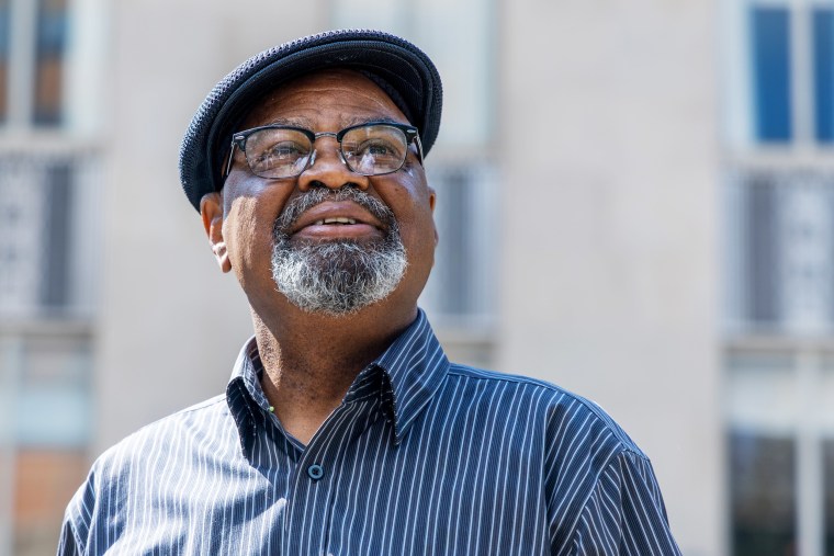 Glynn Simmons smiles in front of the Oklahoma County Courthouse  in September 2023.