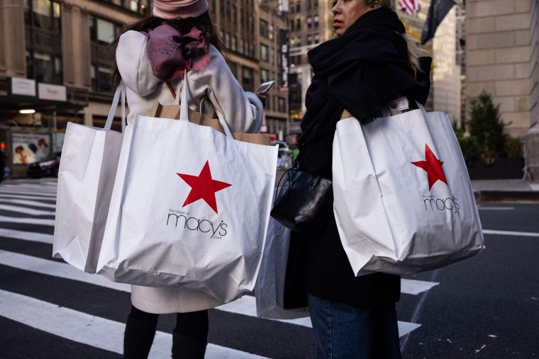 Shoppers carry Macy's bags during "Black Friday" in New York 