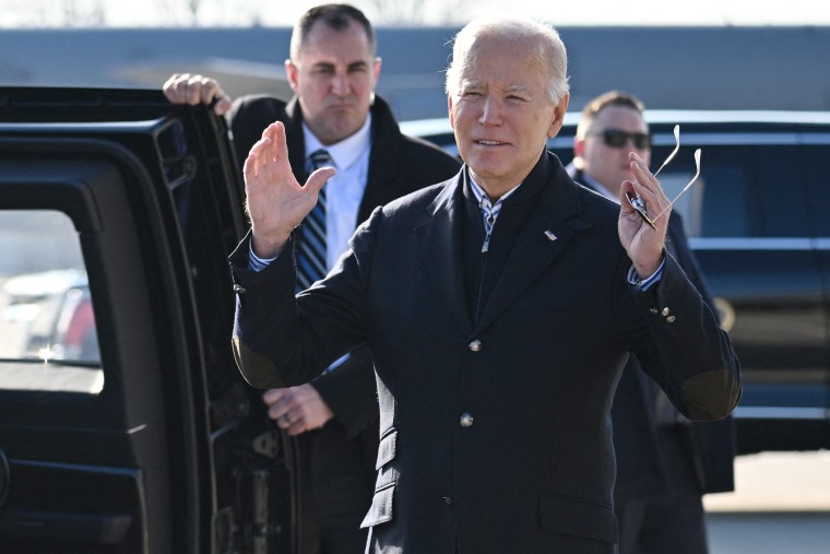 US President Joe Biden responds to questions by members of the media upon arrival at Milwaukee 