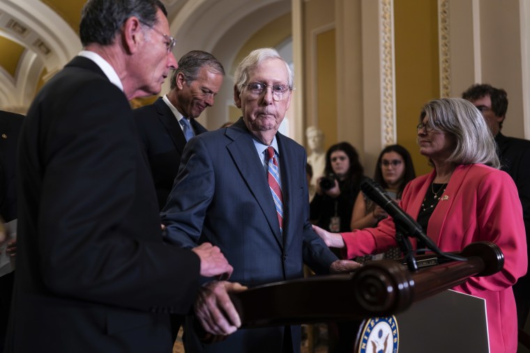 Senators support Sen. Mitch McConnell during a press conference.
