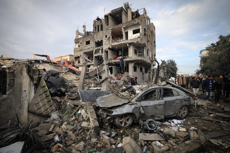 Palestinians inspect the damage.