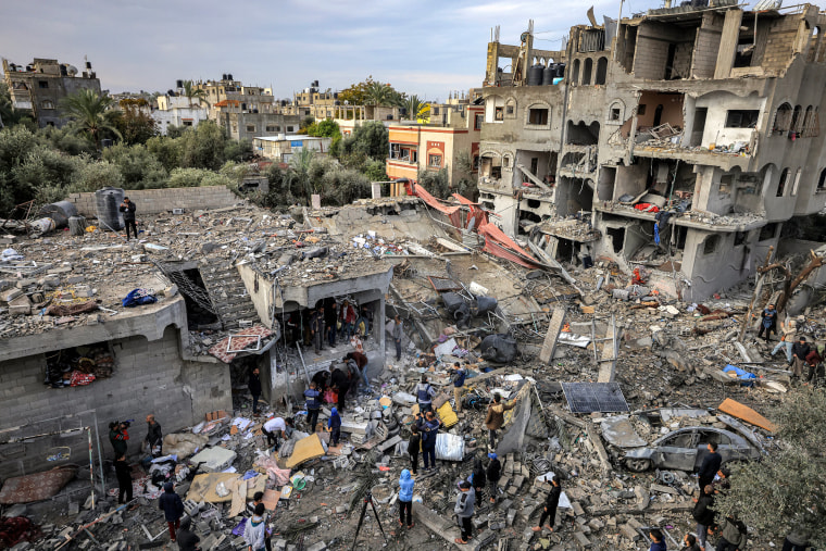 The body of a victim killed in an overnight Israeli strike at the al-Maghazi refugee camp is recovered.