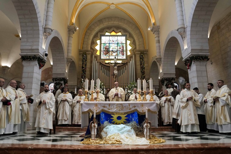 Latin Patriarch Pierbattista Pizzaballa leads the Christmas morning Mass at the Chapel of Saint Catherine.