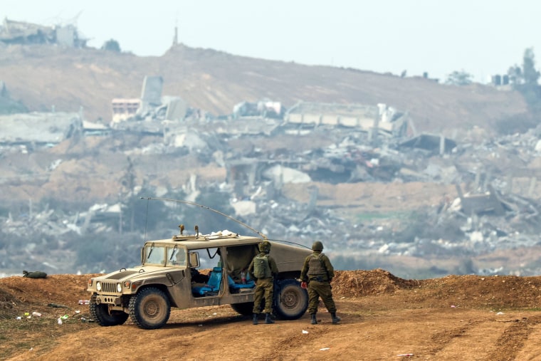 Israeli soldiers patrol along the Israel-Gaza border on Dec. 27, 2023.