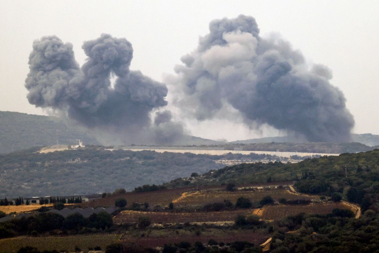 Smoke billows in the southern Lebanese village of Marwahin following Israeli bombardment on Dec. 27, 2023.