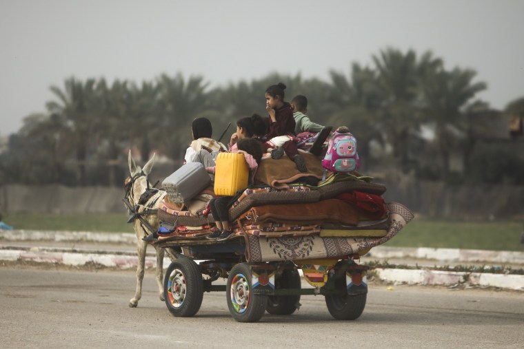 Palestinians flee the Israeli ground offensive in Khan Younis, Gaza Strip, Wednesday, Dec. 27, 2023.