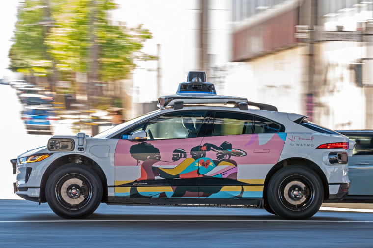 Image: A Waymo autonomous taxi