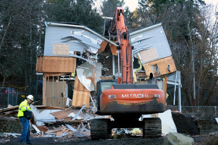 Heavy equipment is used to demolish the house where four University of Idaho students were killed.
