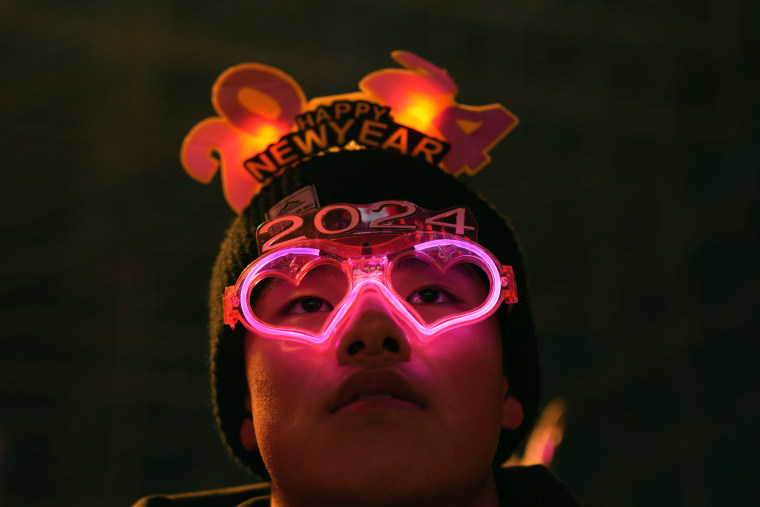 A reveler wears neon spectacles to ring in the new year in Beijing on Sunday.