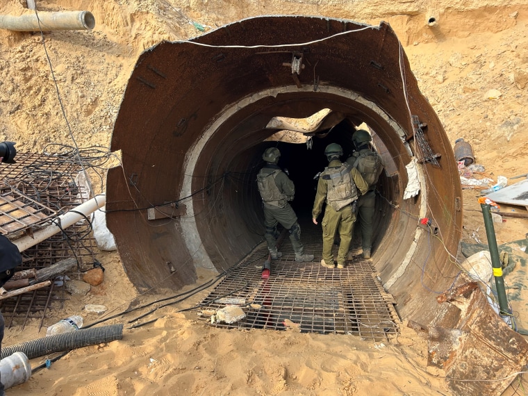 Israeli soldiers stand at the entrance of what the military says is the largest tunnel yet discovered in Gaza near the Erez crossing in the north of the enclave.