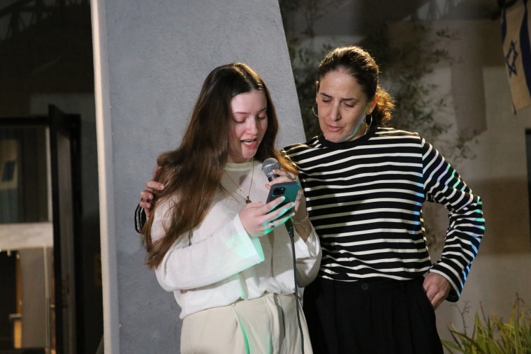 Agam Goldstein-Almog, who was released in the hostage deal alongside her mother, Chen Goldstein-Almog, speaks at a Hanukkah event in Shefayim, Israel. 