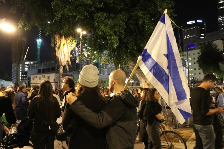 Hundreds of people filled the streets outside Israel's defense ministry in Tel Aviv after the IDF announced it had mistakenly killed three Israeli hostages held in northern Gaza.