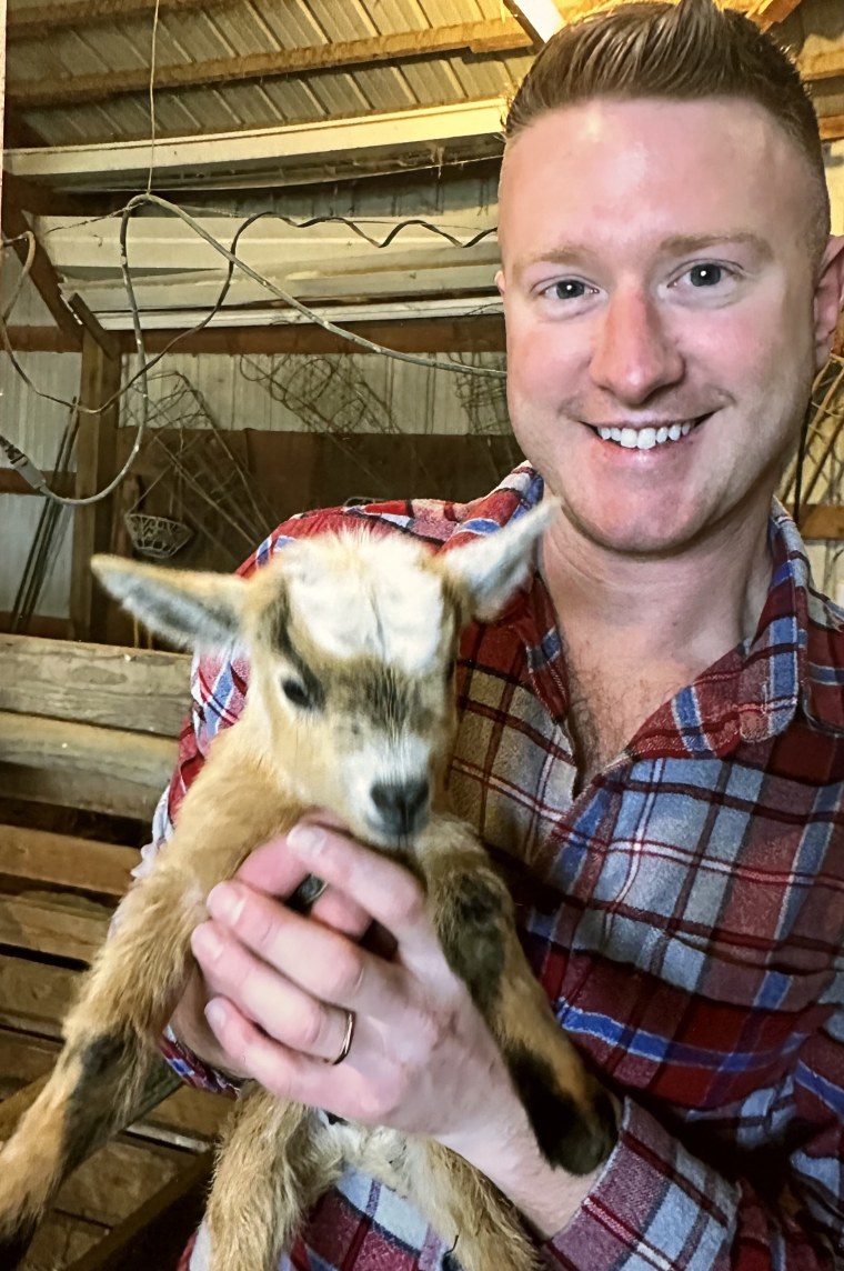 Tyler holding a goat