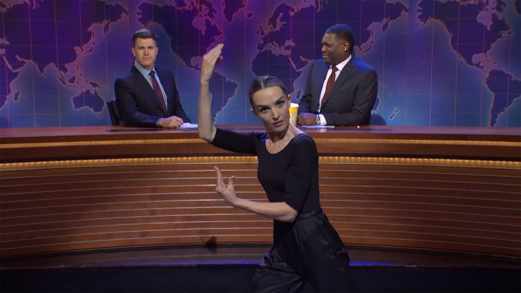Chloe Fineman demonstrates "street ballet" for Colin Jost and Michael Che on “Weekend Update.”