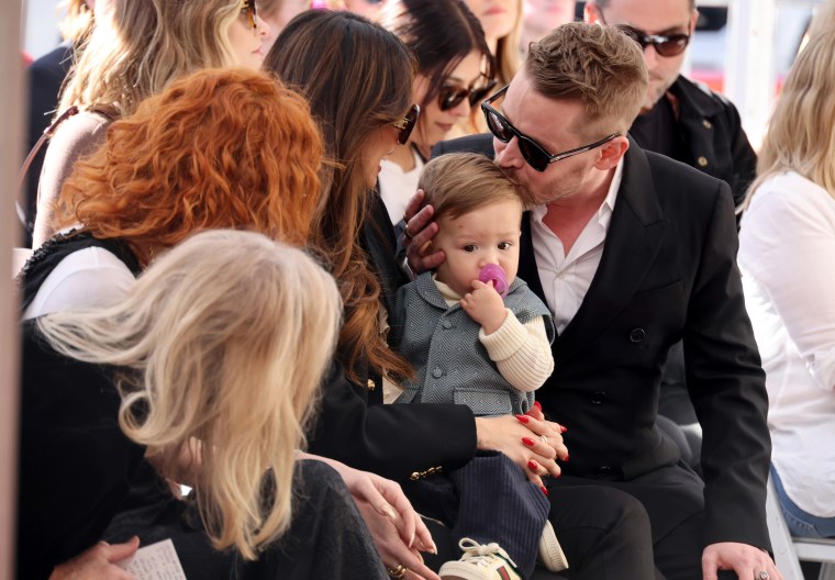 Macaulay Culkin, Brenda Song and their younger son at his Hollywood Walk of Fame ceremony.