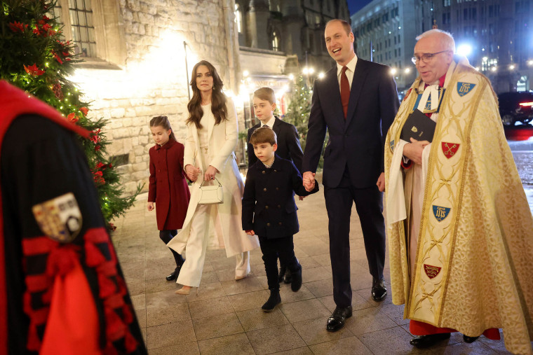 Princess Charlotte of Wales, Catherine, Princess of Wales, Prince Louis of Wales, Prince George of Wales, Prince William, Prince of Wales and The Dean of Westminster Abbey, The Very Reverend Dr David Hoyle attend The "Together At Christmas" Carol Service at Westminster Abbey on December 08, 2023 in London, England.
