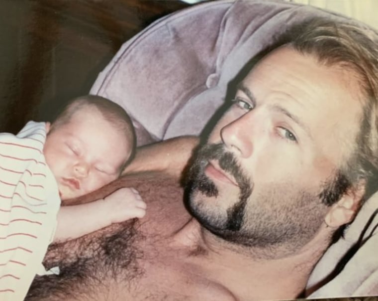A baby Rumer Willis sleeps on the chest of her famous dad, Bruce Willis