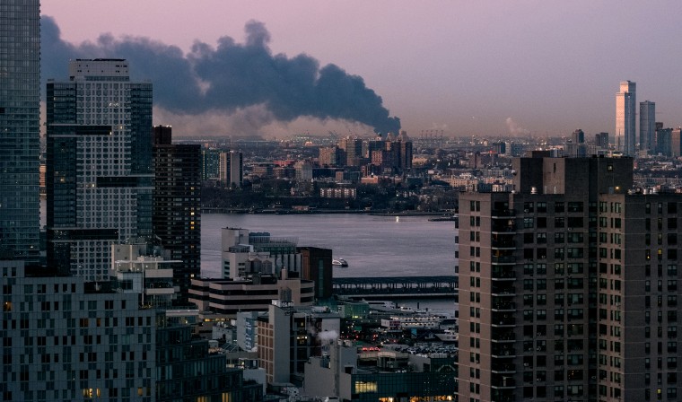 A warehouse burnsspreading smoke over the southern skyline of New York in Elizabeth, N.J.,  on Jan.  5, 2024.