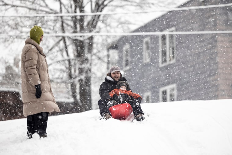 Residents sled down a hill during a storm in Hudson, New York on Jan. 7, 2024.