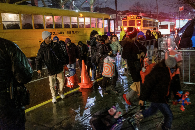 Migrants evacuated from Floyd Bennett Field arrive at James Madison High School on Bedford Avenue in Brooklyn, New York during a storm on Jan. 9, 2024. 