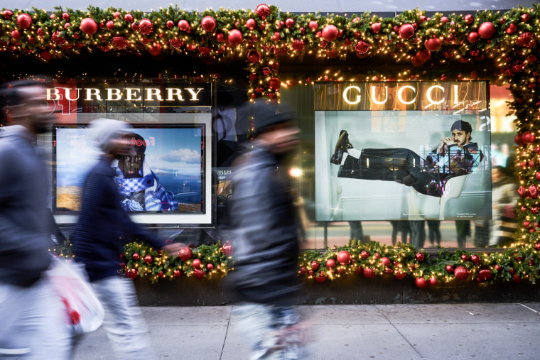 Shoppers walk past the Macy's Inc. flagship store in New York City on Nov. 13, 2023.  
