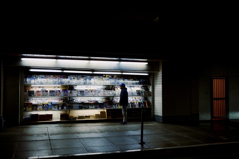 An attendant stands idly by shortly before closing time, at Al's Newsstand in Beverly Hills, Calif, on Jan. 22, 2024.