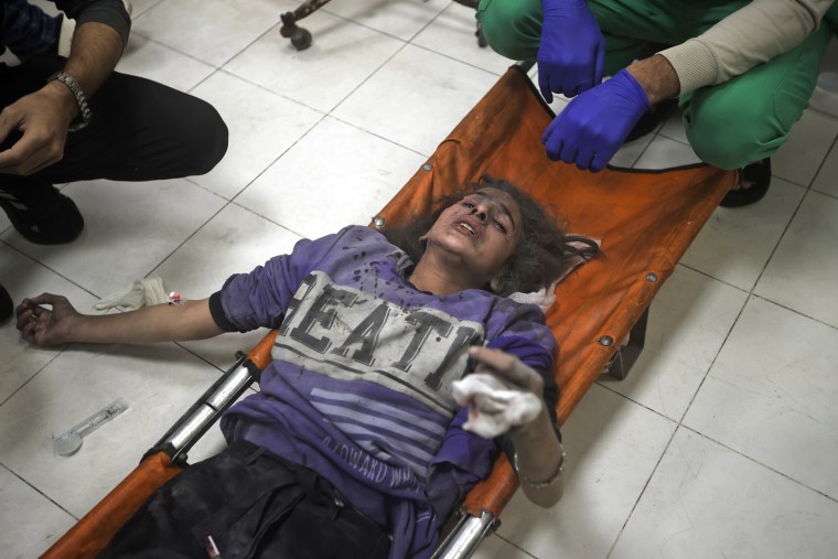 A wounded Palestinian girl receives treatment at the Nasser hospital in Khan Younis, southern Gaza, Tuesday, Jan. 2, 2024.