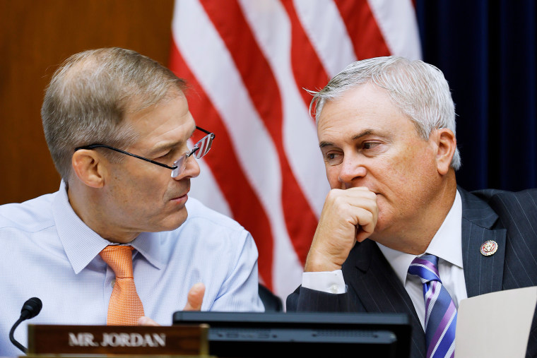 Reps. Jim Jordan and James Comer talk during a hearing on Capitol Hill.