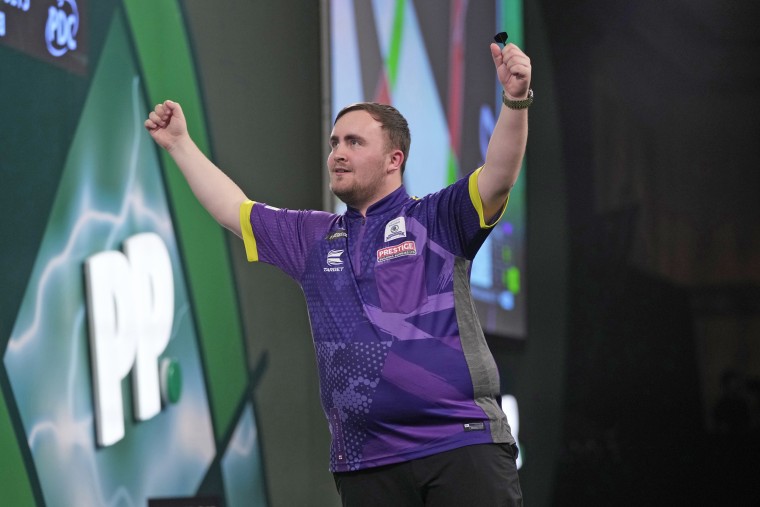 Luke Littler of England celebrate after winning the semifinal match against Scott Williams of England at the World Darts Championship, in London on Jan. 2, 2024. 