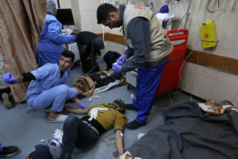 Injured are treated at the al-Aqsa hospital in Deir al-Balah, central Gaza, on Dec. 30, 2023.
