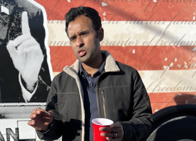 Vivek Ramaswamy speaks to the press after campaigning in Oskaloosa, Iowa