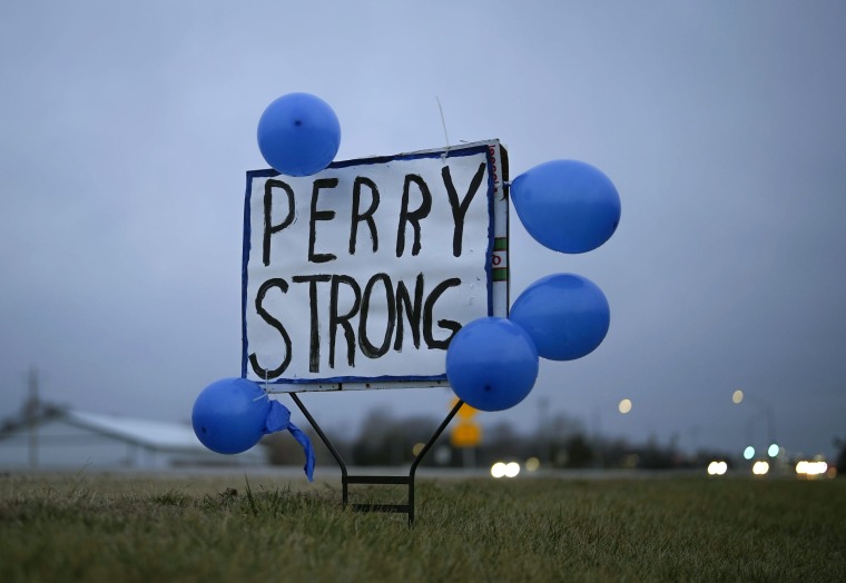 A sign along Highway 141 in Granger, Iowa, shows support for the neighboring community of Perry on Friday after a shooting at the Perry Middle School and High School building Thursday.