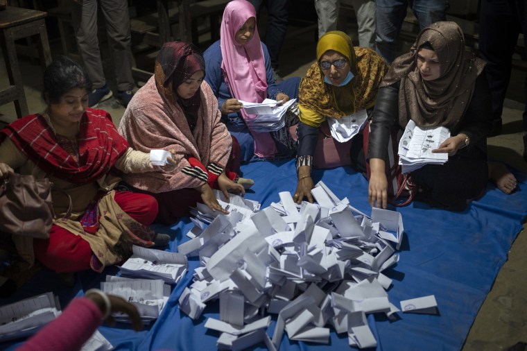 Bangladeshi polling officials counting votes outside Dhaka on Sunday.