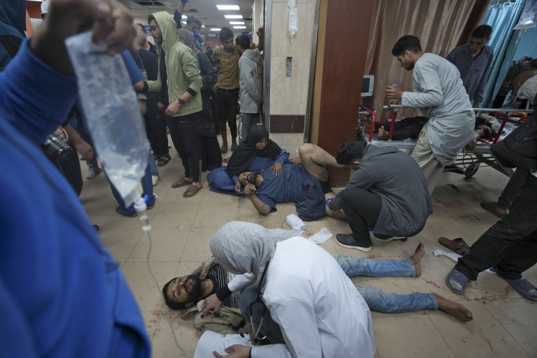 Wounded Palestinians are treated at Al Aqsa hospital in Deir al Balah, Gaza Strip, Sunday, Jan. 7, 2024.