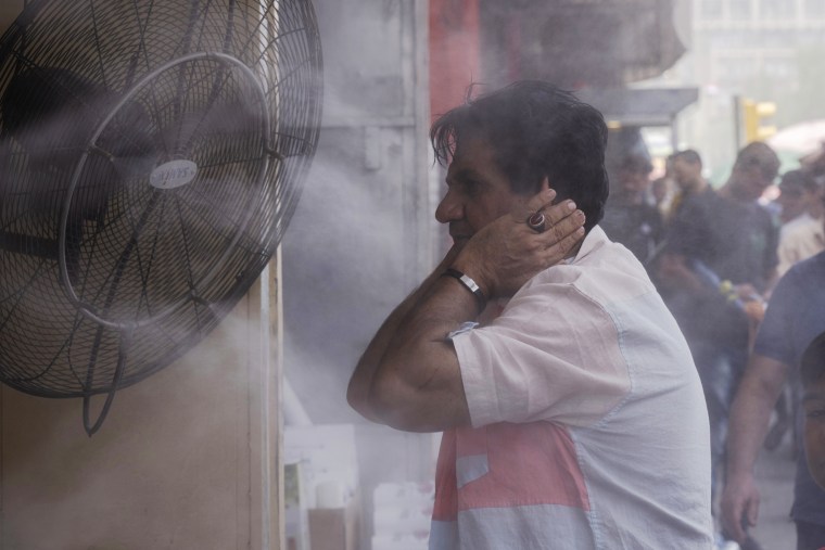A man cools off during a heat wave in Baghdad on July, 6, 2023. 