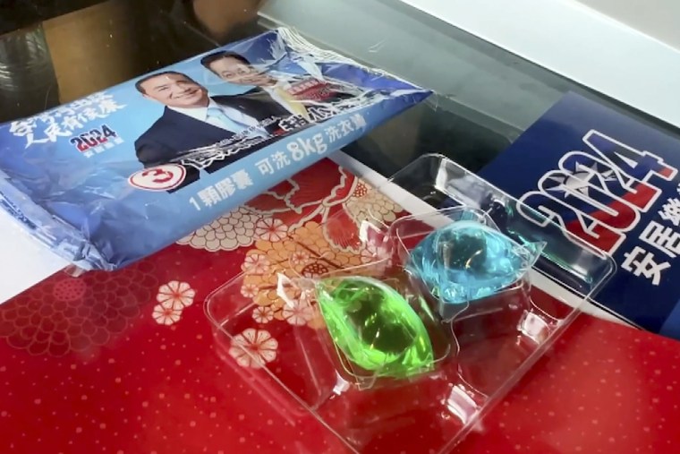 At least three people have been hospitalized after mistakenly eating colorful pods of liquid laundry detergent that were distributed as a campaign freebie in Taiwan’s presidential race. 
