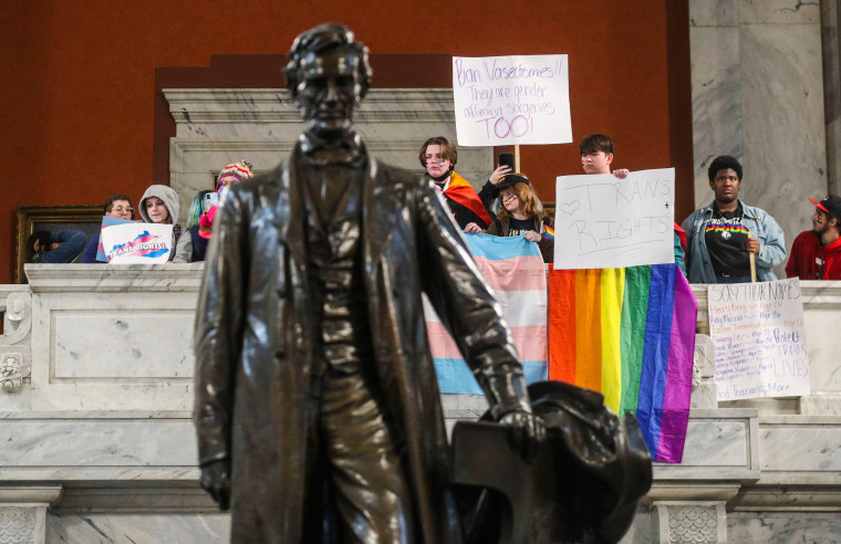 Demonstrators rally to oppose a bill that would ban gender-affirming care for trans youth at the Kentucky State Capitol in Frankfort on March 29, 2023.