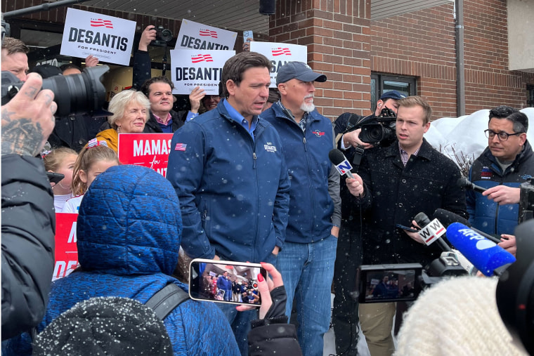 Florida Gov. Ron Desantis speaks to reporters outside his campaign office in Urbandale, Iowa, on Jan. 12, 2024. 