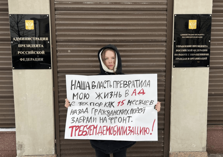 A Russian woman protests outside the sefense ministry in Moscow earlier this month.