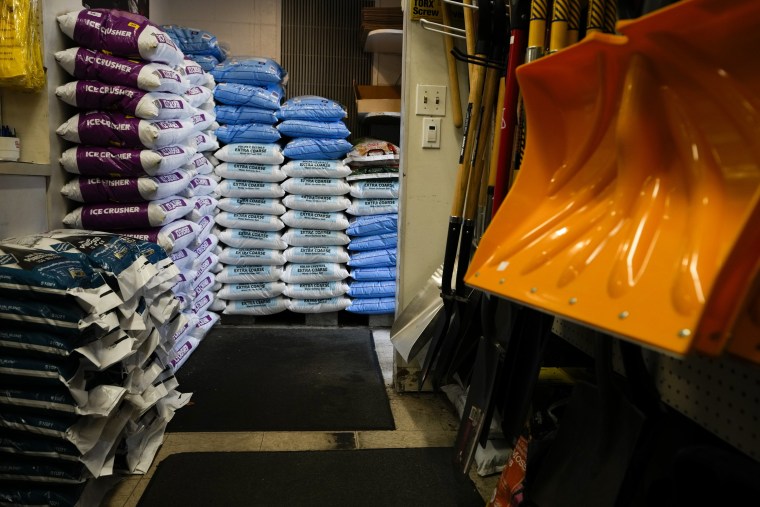 Salt and shovels are displayed for sale at Ankeny Hardware on Thursday, Jan. 11, 2024, in Portland, Ore. The Pacific Northwest is bracing for a frigid cold snap and heavy snow in the Cascades.