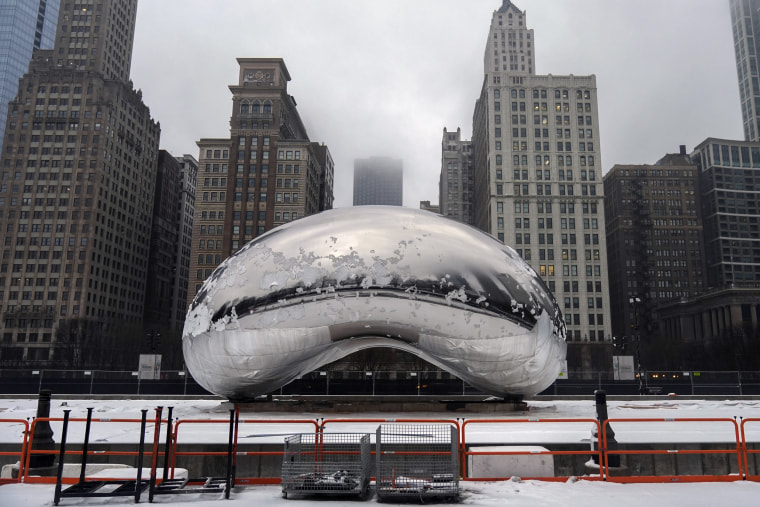 Snow covers the Cloud Gate sculpture in Millennium Park after a winter storm in Chicago on Friday.